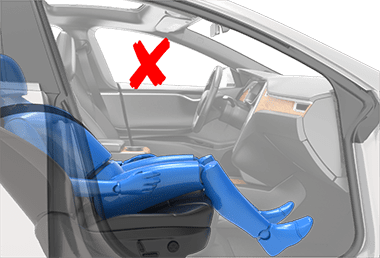 Person sitting in a car seat incorrectly with the backrest in a laying down position