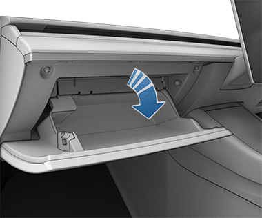 Image with an arrow showing the glove box opening.
