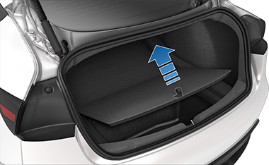 Rear trunk with arrow pointing upwards from cargo cover strap