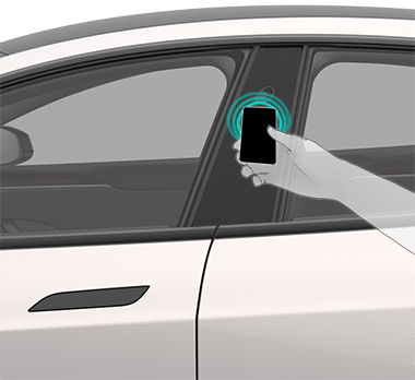 Image of a person touching the key card to the driver's side door pillar.