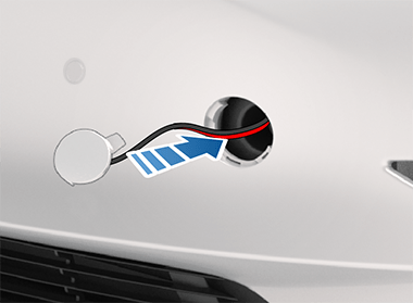 Arrow showing to install the tow eye cover.