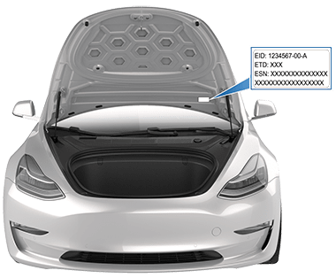 Front trunk open with arrow pointing to label location on underside of front hood