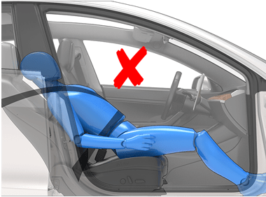 a person reclining the seat while the car is in motion and a red x