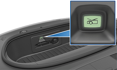 A button inside the front trunk with an image of a car with its trunk open