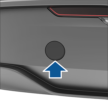 Freccia rivolta verso il coperchio dell'occhiello di traino del veicolo.