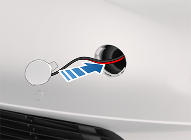 Arrow showing to install the tow eye cover.