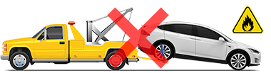 Model X being towed with front wheels on ground and rear wheels lifted by a tow truck and a red "X" to indicate this should not be performed.