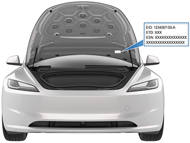 Front trunk open with arrow pointing to label location on underside of front hood