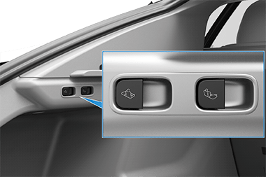 A zoombox showing a switch on the left side of the rear trunk
