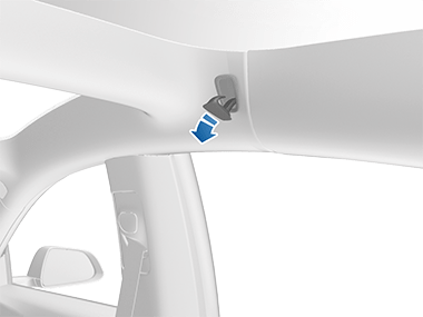 Coat hanger above rear window with arrow pointing outwards