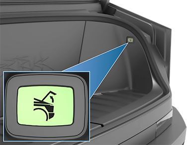 Interior del maletero delantero con un recuadro ampliado del botón de desbloqueo de emergencia