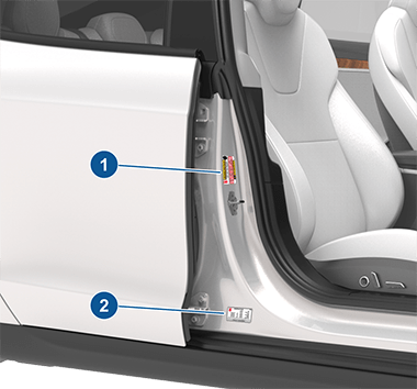 Two labels on center door pillar indicating how much weight the vehicle can carry
