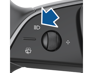 Closeup of high beam button on steering yoke.