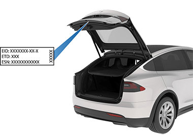Rear trunk open with an arrow pointing to label on liftgate