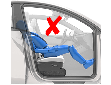 a person reclining the seat while the car is in motion and a red x